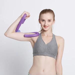 Woman using a purple portable thigh resistance trainer.