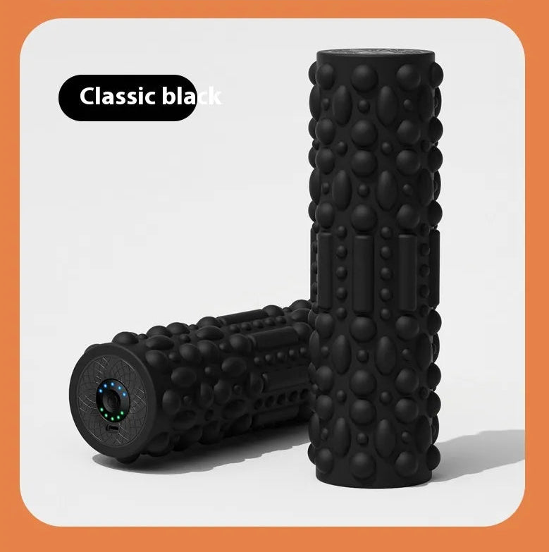 Black foam roller with textured surface on a light gray background.
