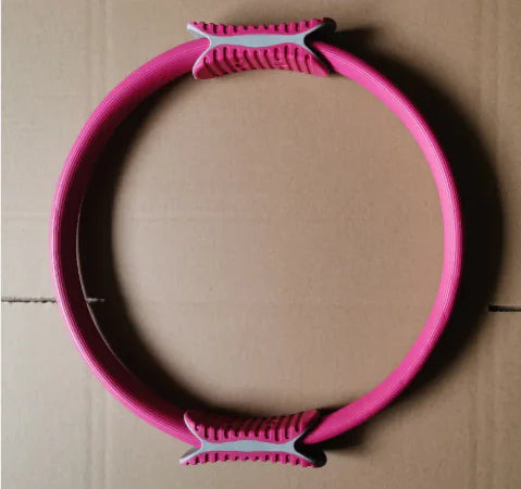 Pink yoga and pilates resistance ring.