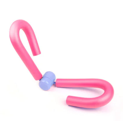 Pink colored portable thigh resistance trainer.