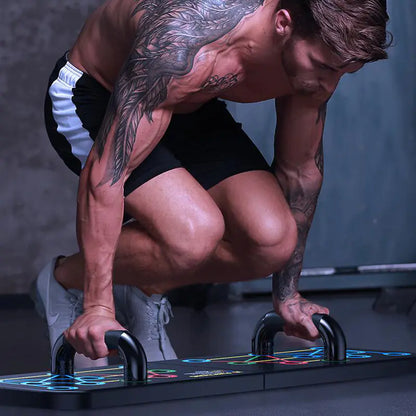 Close-up of color-coded muscle group indicators on push-up training board.