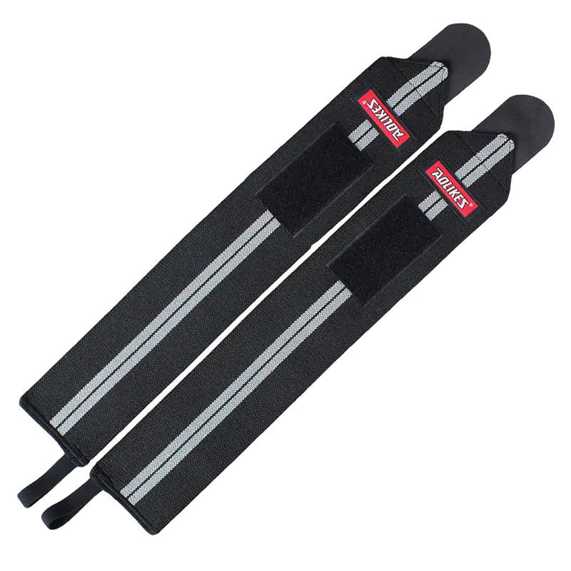 Black gray supportive wrist wraps with adjustable Velcro closure for weightlifting and fitness training.