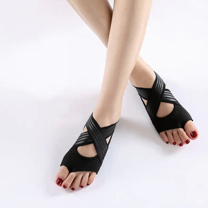 Women's black non-slip yoga shoes with soft flexible sole for indoor fitness and studio training.