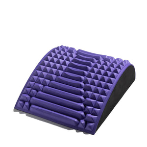 Contoured blue colored yoga pillow with ergonomic design for waist and lower-back support during stretching.