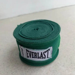 Green boxing hand wraps (9.8ft, pair) for Muay Thai and combat sports hand protection.