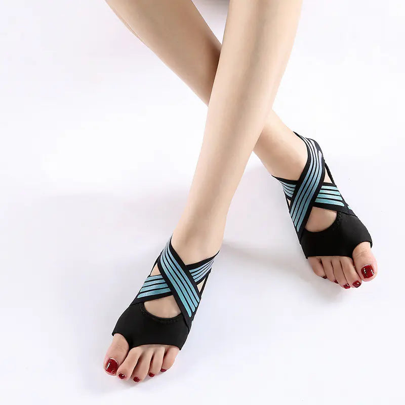 Women's green colored non-slip yoga shoes with soft flexible sole for indoor fitness and studio training.