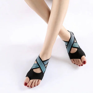 Women's green colored non-slip yoga shoes with soft flexible sole for indoor fitness and studio training.