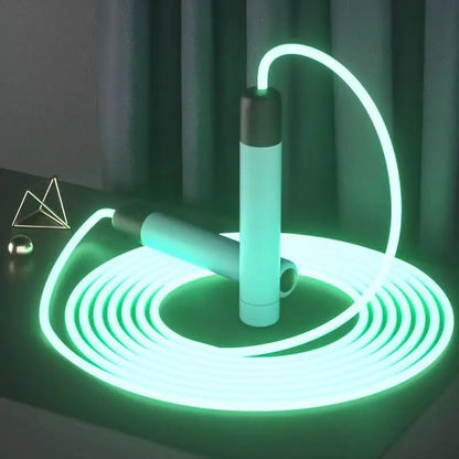 Green luminous (Glow-in-the-dark) jump rope with ergonomic handles for indoor and outdoor cardio workouts.