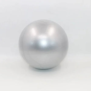 Grey colored portable pilates mini ball for core strengthening, balance training, and yoga exercises.