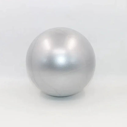 Grey colored portable pilates mini ball for core strengthening, balance training, and yoga exercises.