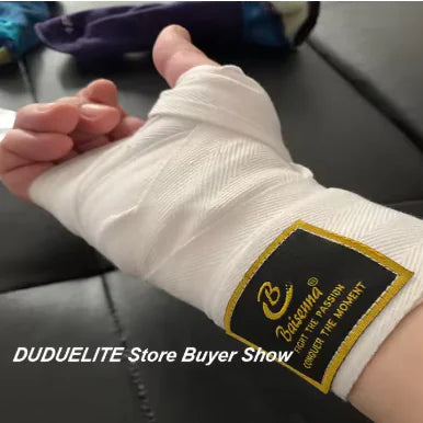 Proper hand wrapping technique with elastic wraps for optimal knuckle and wrist protection.