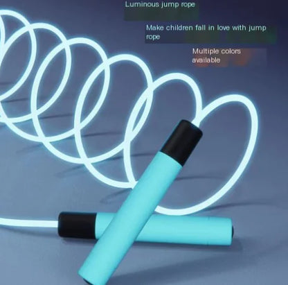 Close-up of glow-in-the-dark jump rope showing illuminated effect in low light conditions.
