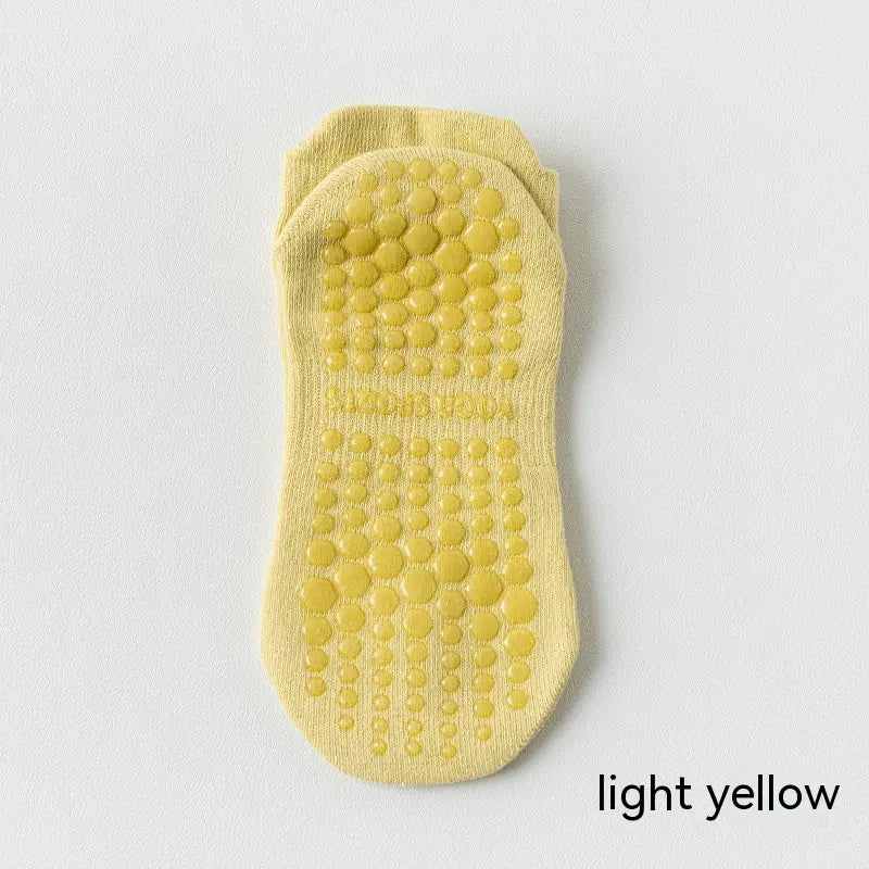 Women's non-slip Pilates socks in light yellow color with silicone grip for yoga, Pilates and barre classes.