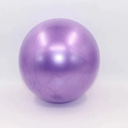 Purple colored portable pilates mini ball for core strengthening, balance training, and yoga exercises.