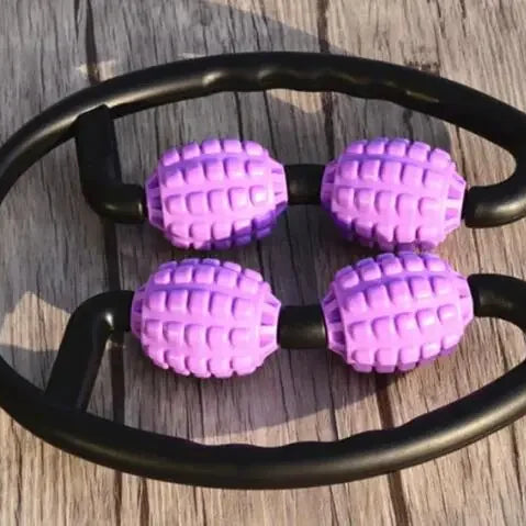 Purple foam massage roller on a wooden surface.