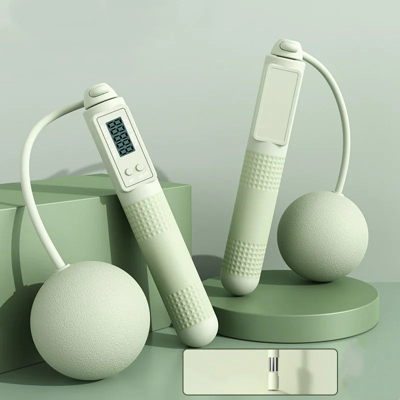 Smart jump rope with big green balls and digital display on a light blue background.