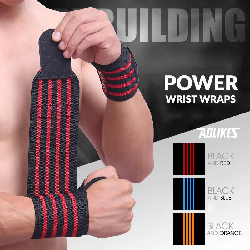 Person wearing black and red supportive wrist wraps with adjustable Velcro closure for a custom fit and secure support.
